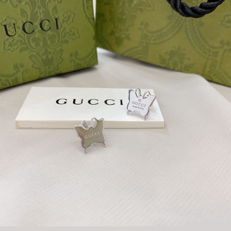 G*u*i earrings
